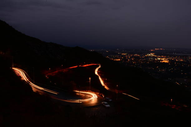 istock Enchanting Trails: The Mesmerizing Lights of Winding Mountain Roads 1493683149