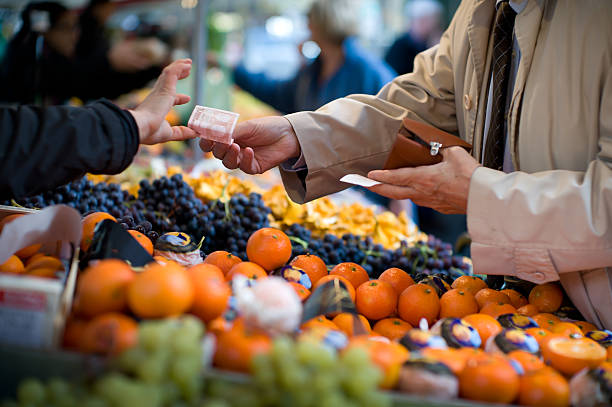 istock Vendor accepts payment at a street market 149368351