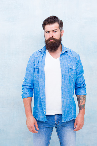 Wear denim almost every single day. Male casual style. Denim look. Brutal hipster with mustache. Barbershop client. Mature hipster with beard. Denim shirt essential basic garment modern wardrobe.