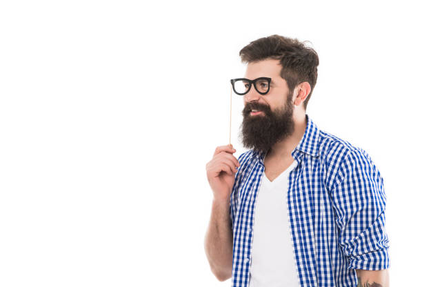 istock cheerful brutal bearded man hold party accessory isolated on white background with copy space 1493685112