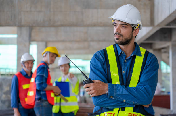 istock stressed engineer manager is gossiped or bullied from foreman team architect workers 1493693303