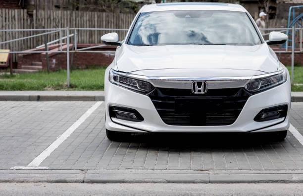 Kuala Lumpur, Malaysia - February 20, 2025: White compact crossover car Honda HR-V (RU) in the city street.