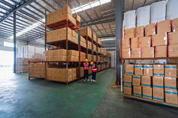 istock Two Asian warehouse staff are conducting logistics warehouse audits and inventory management standard operations. 1493697614