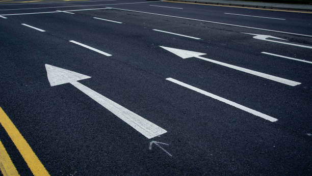 istock Arrow direction signs on asphalt road. Mission future ahead 1493698852