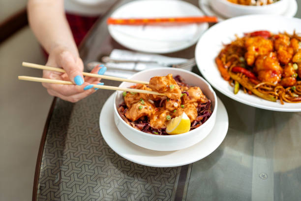 istock Close up of chicken with chopsticks 1493699014