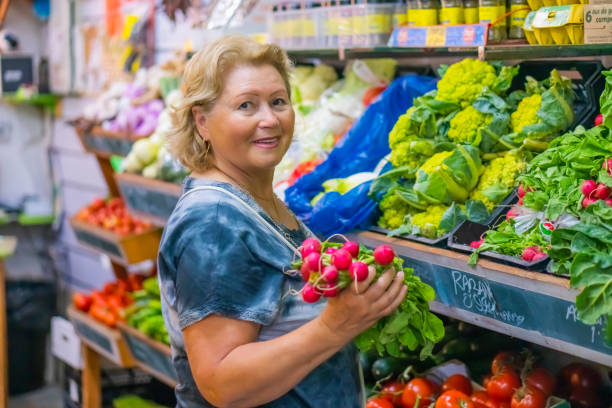 Pensioner lady walking on Organic Market