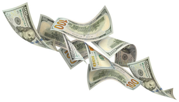 istock Flying 100 American dollars banknotes on white 1493705108