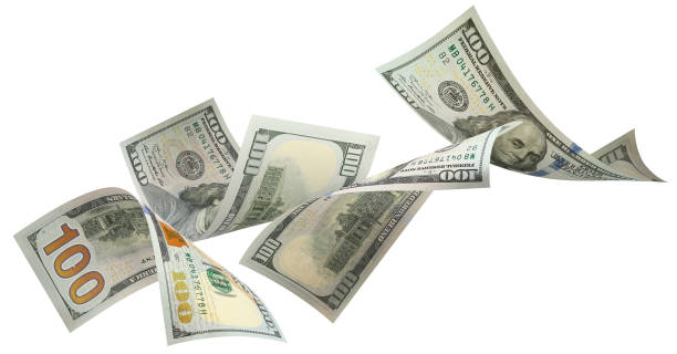 istock Flying 100 American dollars banknotes on white 1493705124