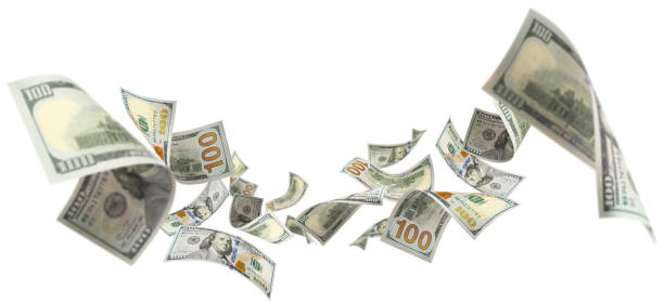 istock Flying 100 American dollars banknotes on white 1493705733