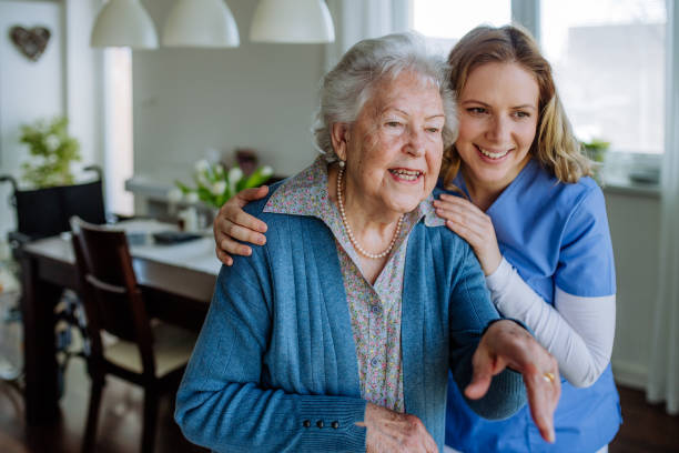 istock Young nurse hugging her senior woman client. 1493705743