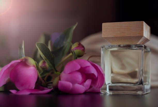 perfume bottle and pink flowers