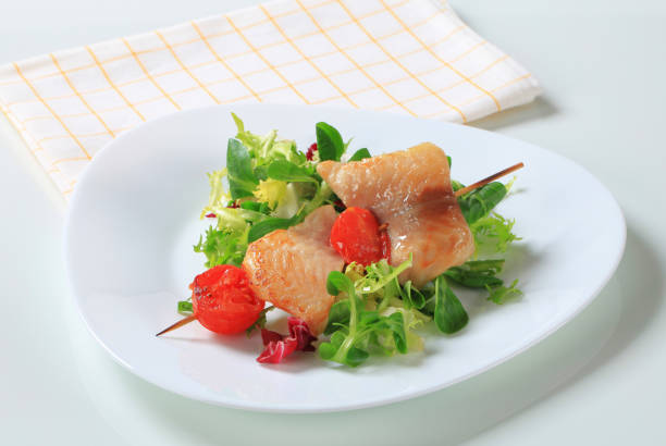 istock Fish skewer and salad greens 149371042