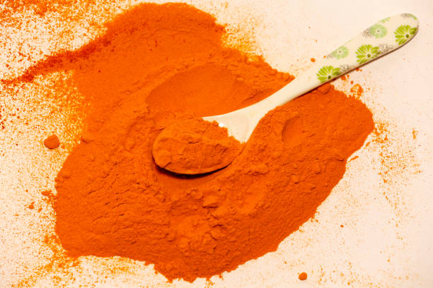 istock Turmeric roots and powder isolated on white background table top view 1493712557