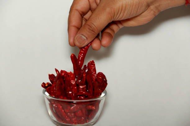 istock Red Chili Pepper In A Glass Bowl Isolated On White Background 1493713144