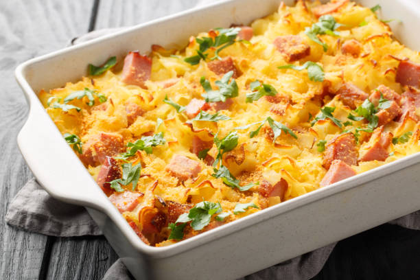 istock Baked Austrian ham pasta so called Schinkenfleckerl closeup on the baking dish. Horizontal 1493718449