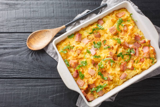 istock Austrian Baked Ham, Cheese, and Noodle Casserole closeup on the baking dish. Horizontal top view 1493719060