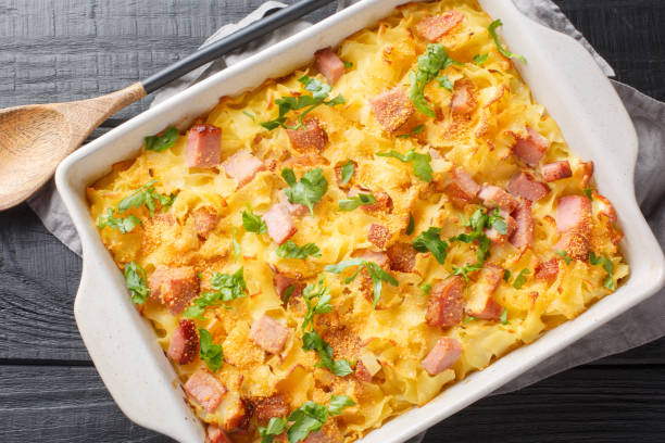 istock Baked Austrian ham pasta so called Schinkenfleckerl closeup on the baking dish. Horizontal top view 1493719066