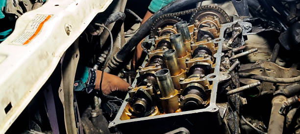 Car mechanic working in his car repair workshop