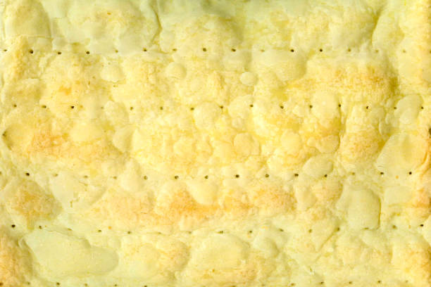 istock Cake layers isolated. Cake making. The texture of the cake for making Napoleon cake from puff pastry and custard. Culinary background for posters and advertising with space for text. 1493723536