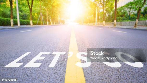 The Straight Highway Surface Is Marked With Lets Go Stock Photo - Download Image Now