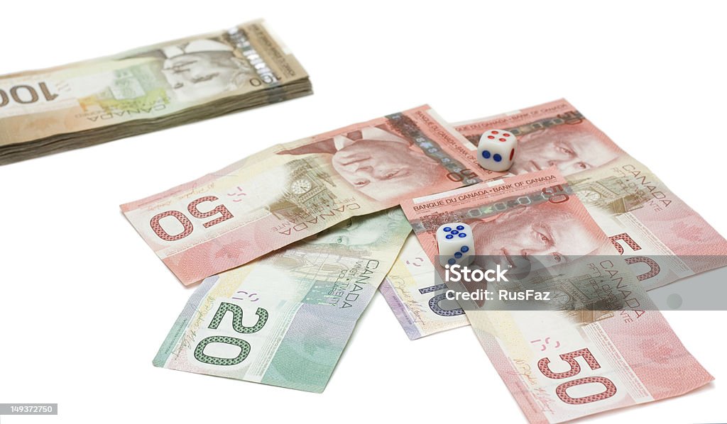 Dólares canadienses con dados - Foto de stock de Blanqueo de dinero libre de derechos