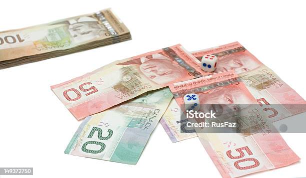 Dólares Canadienses Con Dados Foto de stock y más banco de imágenes de Blanqueo de dinero - Blanqueo de dinero, Canadá, Jugar a juegos de azar