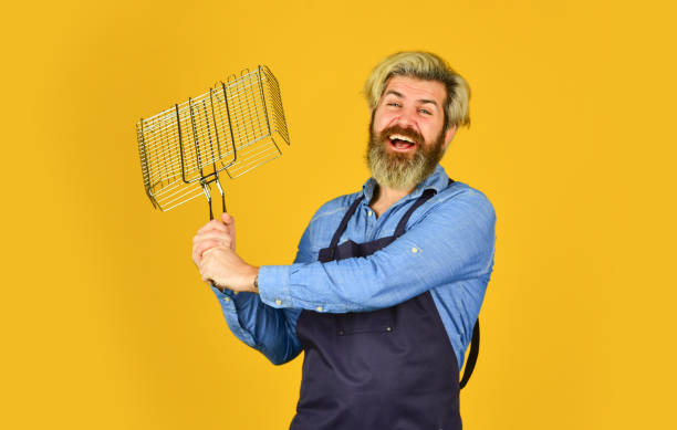 istock Picnic and barbecue. ready for barbecue party. Culinary concept. summer weekend. hipster hold cooking utensils for barbecue. bearded man chef. Tools for roasting meat outdoors 1493729707
