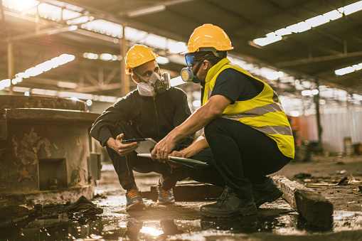 Industry environment impact inspector team work investigate danger chemical oil gas leak with safety face mask