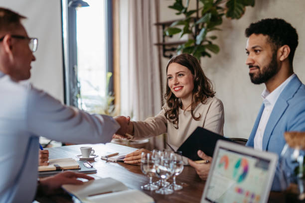 istock Close up of businesmans shaking hands in office. 1493731153