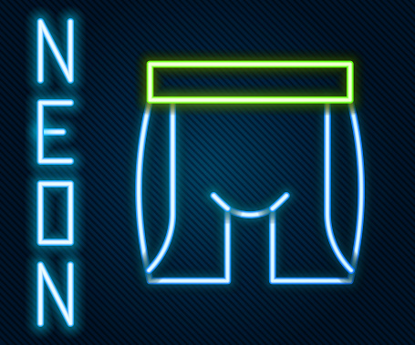Glowing neon line Cycling shorts icon isolated on black background. Colorful outline concept. Vector.