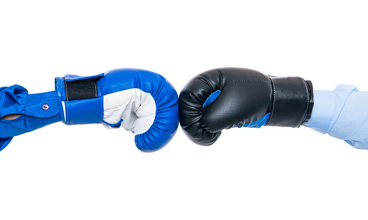 boxing gloves fight isolated on white. boxing gloves fight in studio. boxing gloves fight on background. photo of boxing gloves fight.