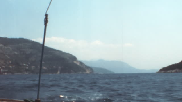 Boat Trip in Dubrovnik Croatia: Azure Sea and Mountains Background in 1970s
