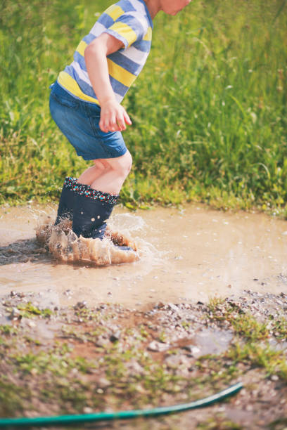 istock Boy jumping in paddles 1493734380