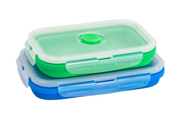 istock Collapsible silicone food storage containers, kitchen food boxes. Food Storage Container. Silicone Lunch Box. Foldable and hermetic seal insulated on a white background. Green. Blue. 1493734852