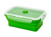 Collapsible silicone food storage containers, kitchen food boxes. Food Storage Container. Silicone Lunch Box. Foldable and hermetic seal insulated on a white background. Green.