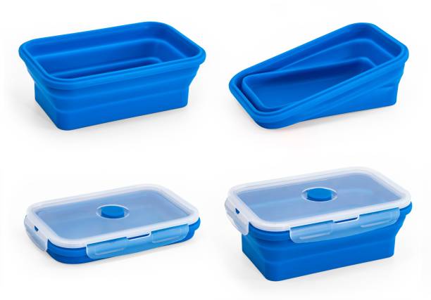 istock Collapsible silicone food storage containers, kitchen food boxes. Food Storage Container. Silicone Lunch Box. Foldable and hermetic seal insulated on a white background. 1493734906