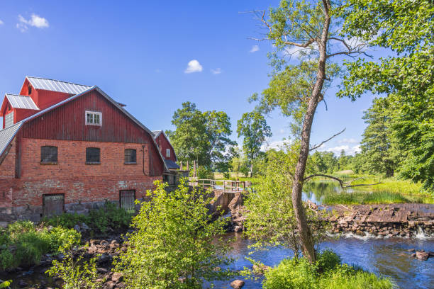istock Water mill by a pond in the countryside 1493735210