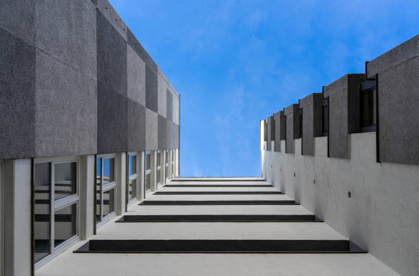 istock Low angle view of modern building against blue sky 1493736263