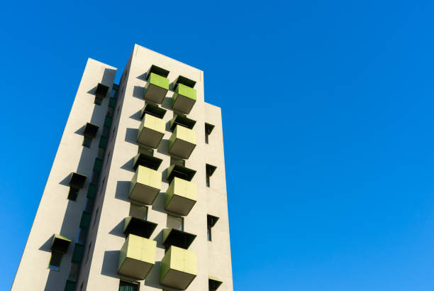 istock Low angle view of modern building against clear blue sky 1493736268