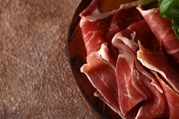 istock organic parma ham dry cured jamon on a wooden board 1493739207