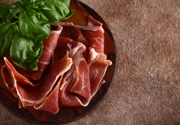 istock organic parma ham dry cured jamon on a wooden board 1493739232