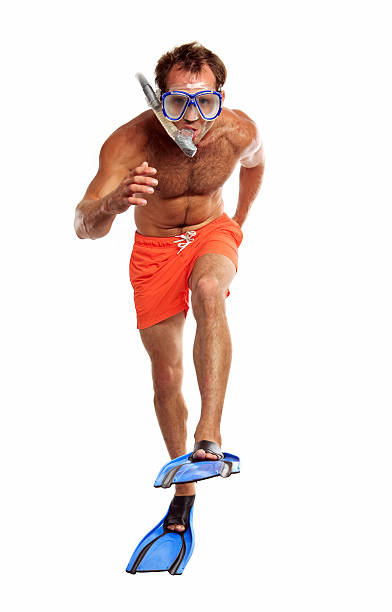 istock Caucasian swimmer wearing mask, snorkel and flippers walking 149374024