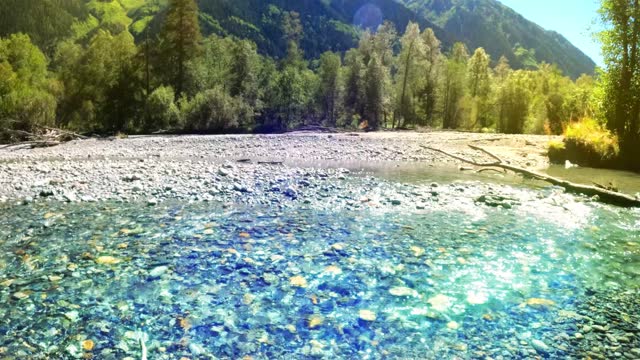 mountain ridge forest river with clear water at summer sunny day - loop video
