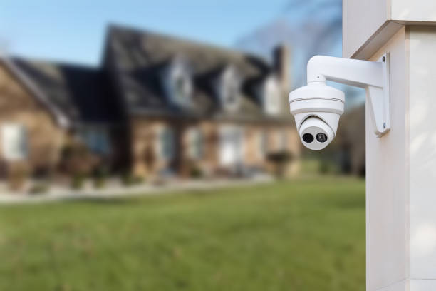 istock CCTV Camera or surveillance operating with house village in background. 1493744342