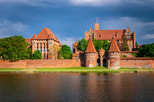 Malbork, Poland - May 13, 2023: Medieval capital of the Teutonic Knights, gothic brick castle Malbork in Poland. Popular tourist attraction and UNESCO heritage site