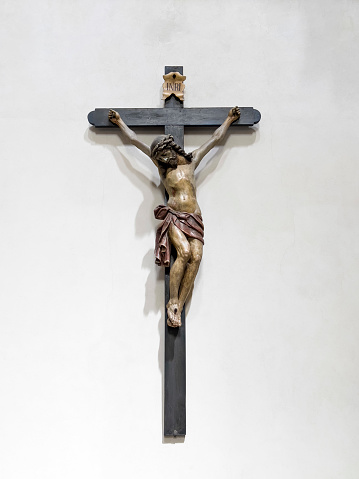 Polychrome wood carving of Jesus Christ crucified inside a temple in Tordesillas, Valladolid-Spain. It is a sculpture for procession in the Christian Holy Week parades