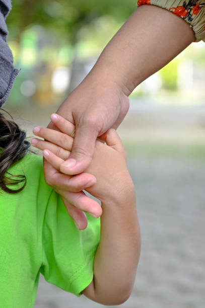 istock Mother's and a child hands 1493749940
