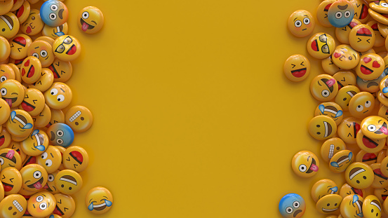 3D rendering of a bunch of emojis with faces with different emotions with centered copy space.