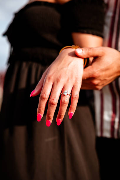 istock Hand with beautiful diamond ring, engagement to be married. 1493750078