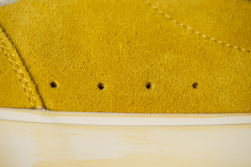 Yellow suede background.